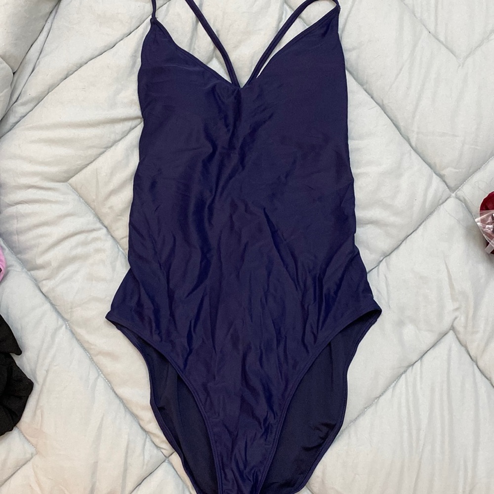 Blue one piece bathing suit with sexy back